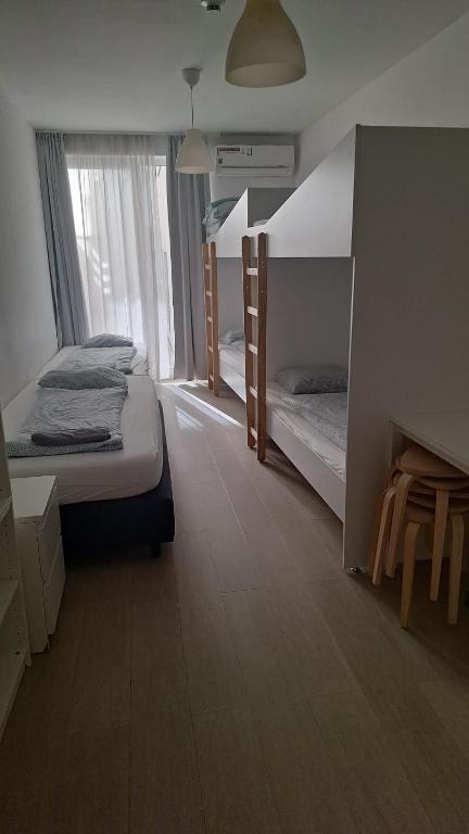 Postel nebo postele na pokoji v ubytování Betariel'com Hauptbahnhof
