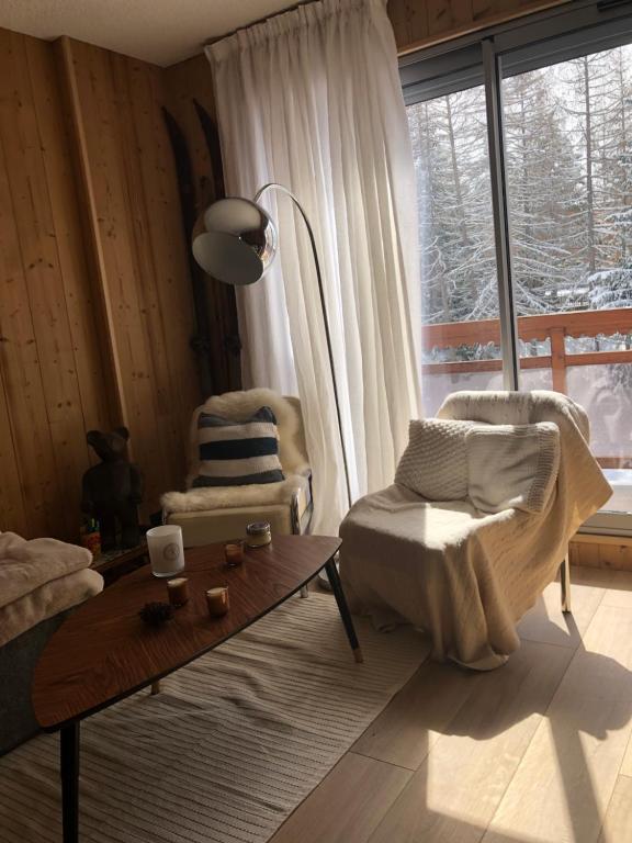 Posezení v ubytování Appartement 6 personnes aux 2 Alpes, au pied des pistes - Wi-fi, Parking gratuit, Terrasse vue sur jardin