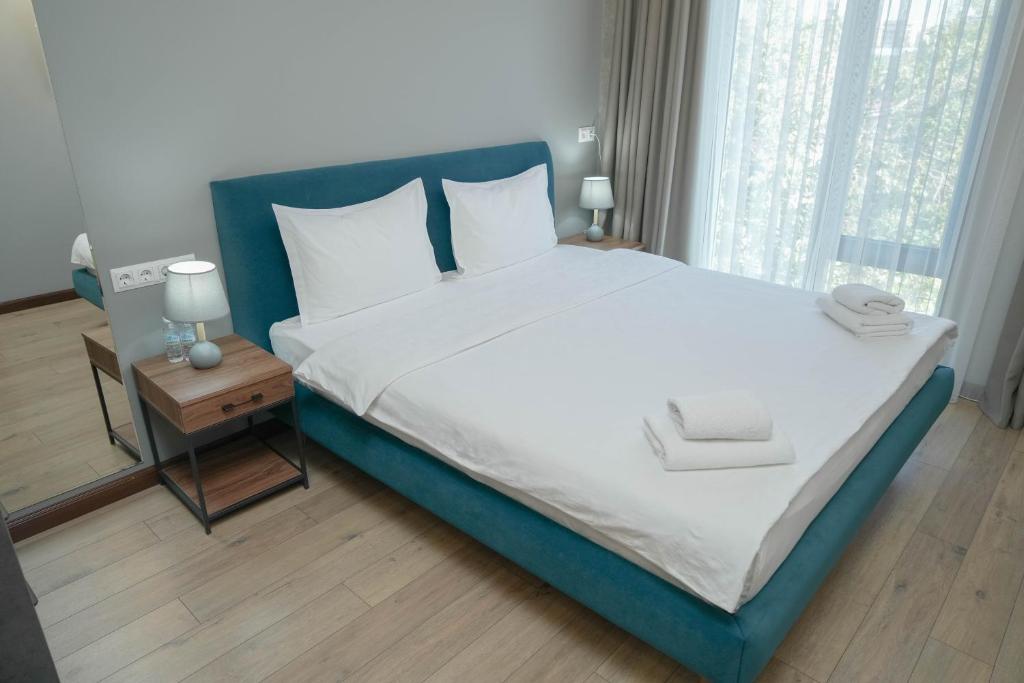 Postel nebo postele na pokoji v ubytování Gastello hotel