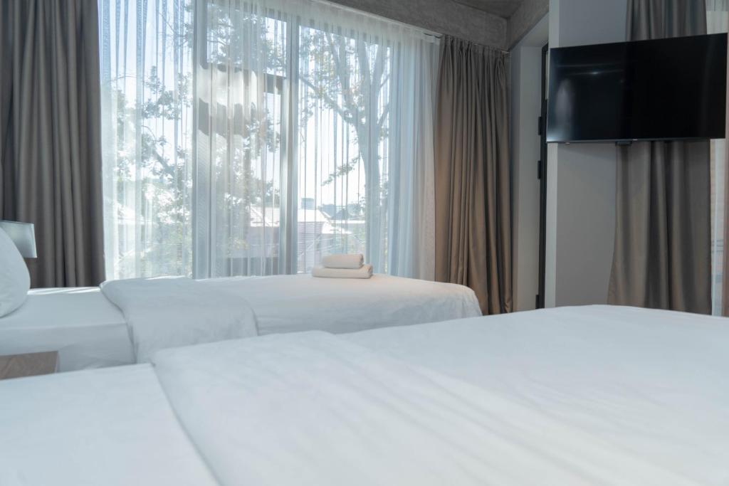 Postel nebo postele na pokoji v ubytování Gastello hotel