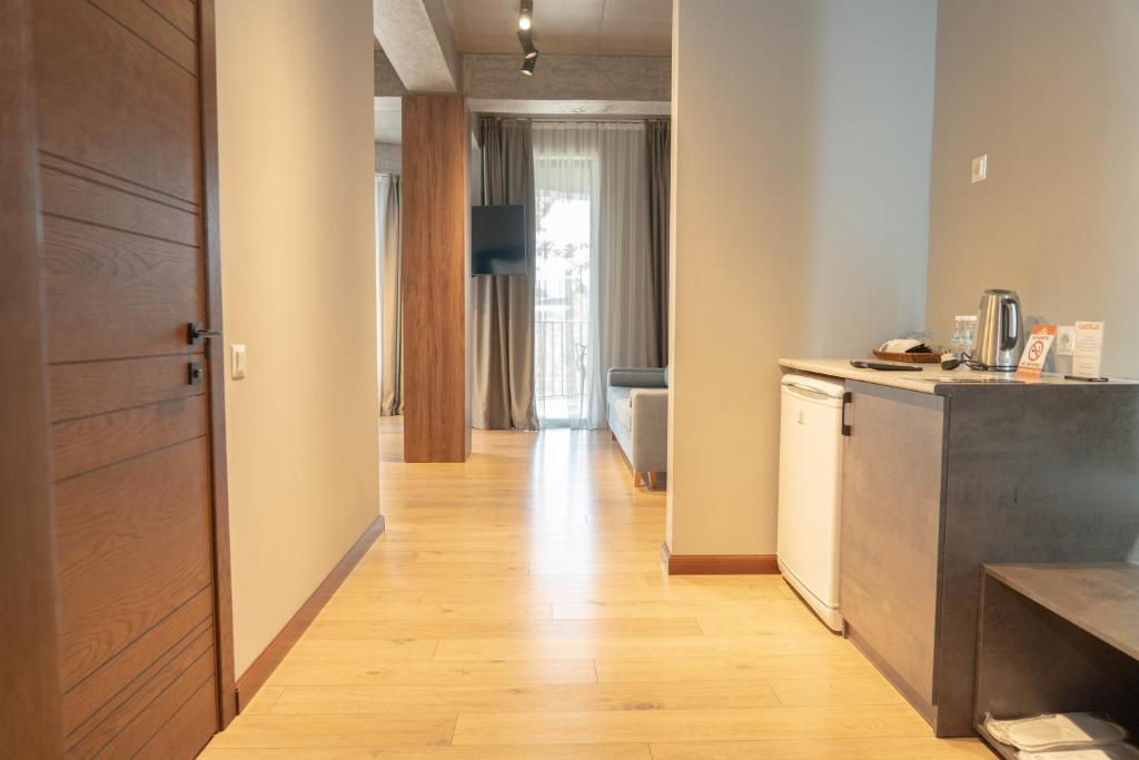 Kuchyň nebo kuchyňský kout v ubytování Gastello hotel