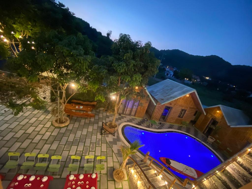 an overhead view of a swimming pool at night at Cat Ba Rustic Homestay in Cat Ba