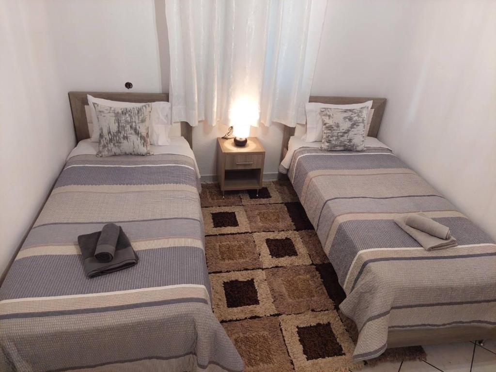 Postel nebo postele na pokoji v ubytování Bellissimo house