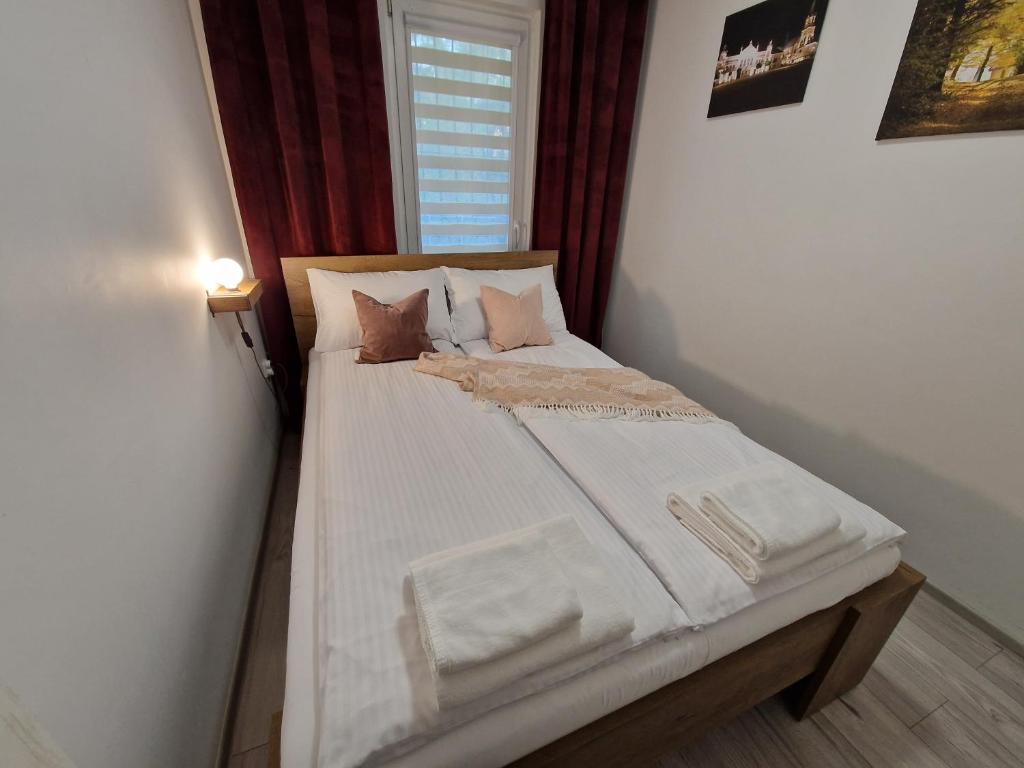 Postel nebo postele na pokoji v ubytování Apartament w Śródmieściu