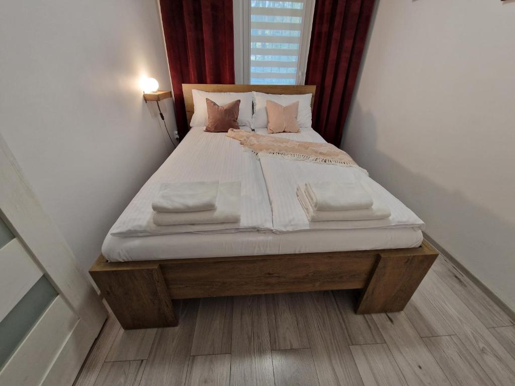 Postel nebo postele na pokoji v ubytování Apartament w Śródmieściu