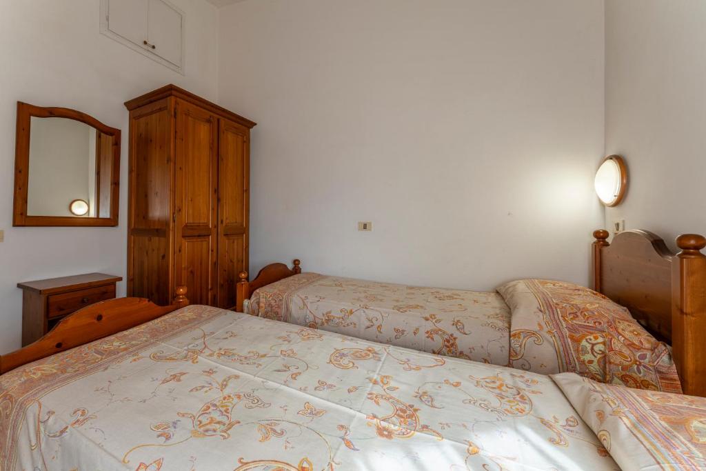 Postel nebo postele na pokoji v ubytování Argentario Giannella Apartment
