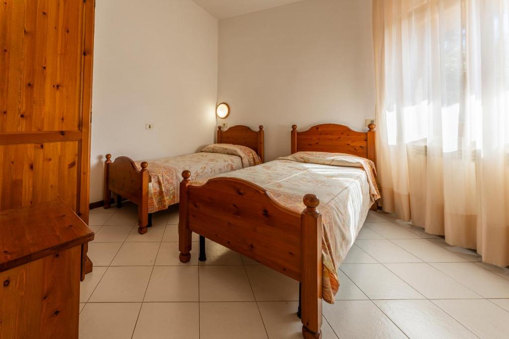 Postel nebo postele na pokoji v ubytování Argentario Giannella Apartment