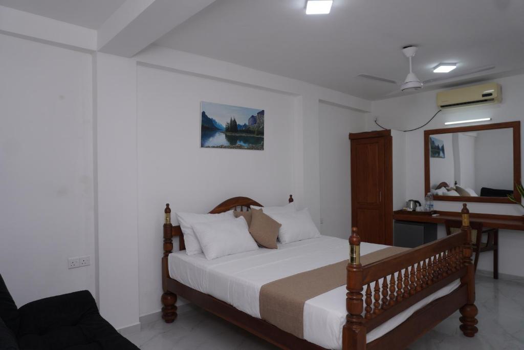 Postel nebo postele na pokoji v ubytování SURF UNA BEACH HOTEL