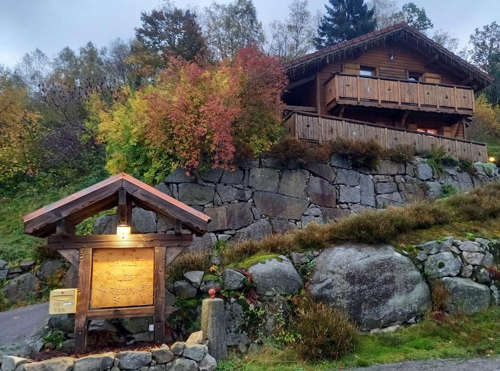 a house on a hill with a light in front of it at Chalet Typique Vosgien "les Barbotines" in Ventron