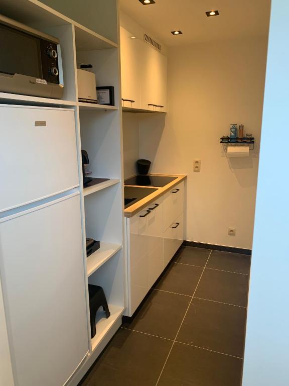 Kuchyň nebo kuchyňský kout v ubytování Q Guesthouse