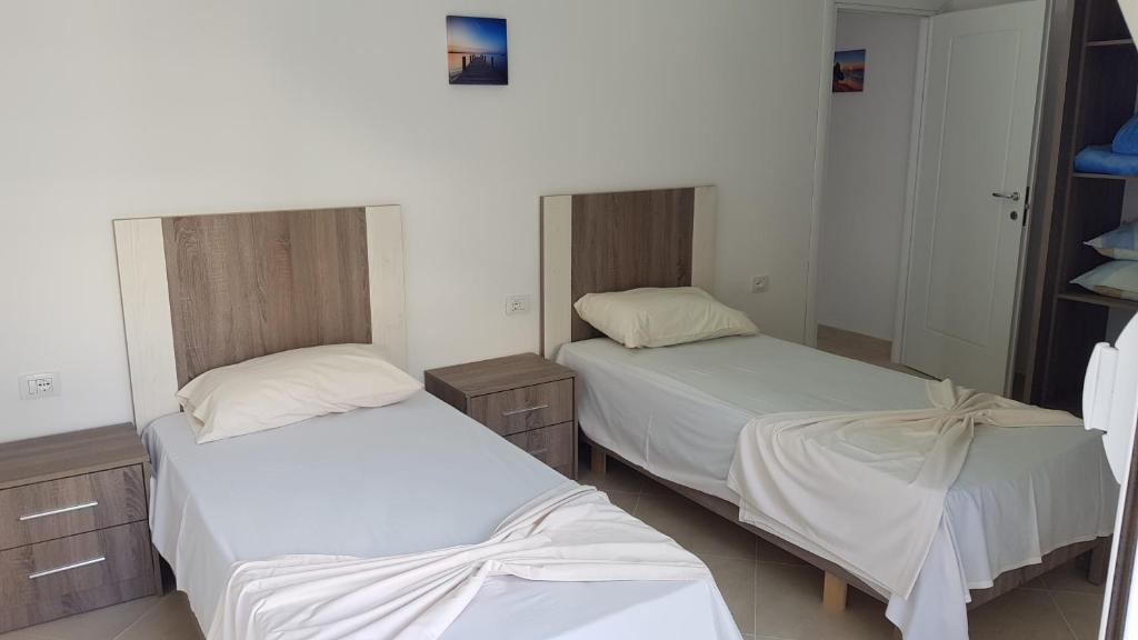 Postel nebo postele na pokoji v ubytování Villa Arberia