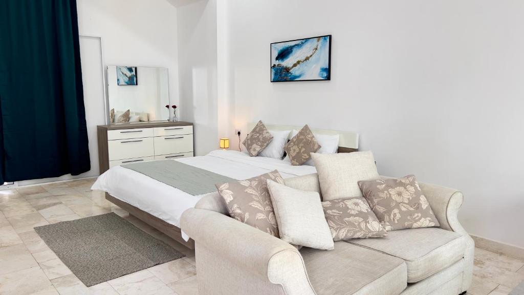 Voodi või voodid majutusasutuse Wadi Shab Beach Villa toas