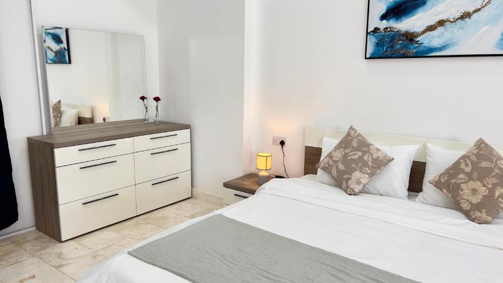 Voodi või voodid majutusasutuse Wadi Shab Beach Villa toas
