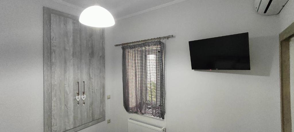 Televízia a/alebo spoločenská miestnosť v ubytovaní Maria's house