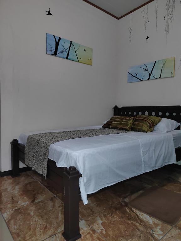 Postel nebo postele na pokoji v ubytování Salamandra Costa Rica