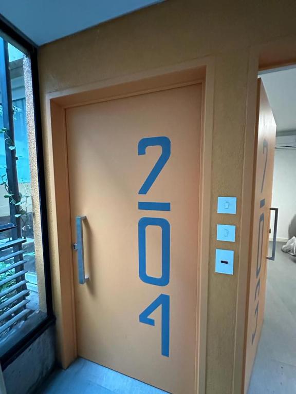 a door with the number on the side of it at Montañeses 2342 Fleny in Buenos Aires