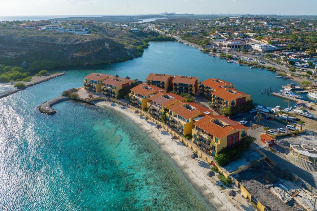 an aerial view of a resort next to a body of water at Palapa Beach Oasis in Jan Thiel