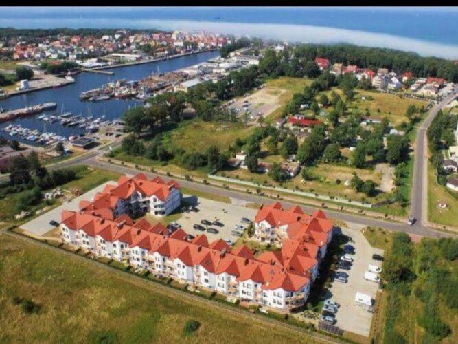 an aerial view of a large building with a marina at Comfortable apartment for 5 people, Dar ówko in Darłówko