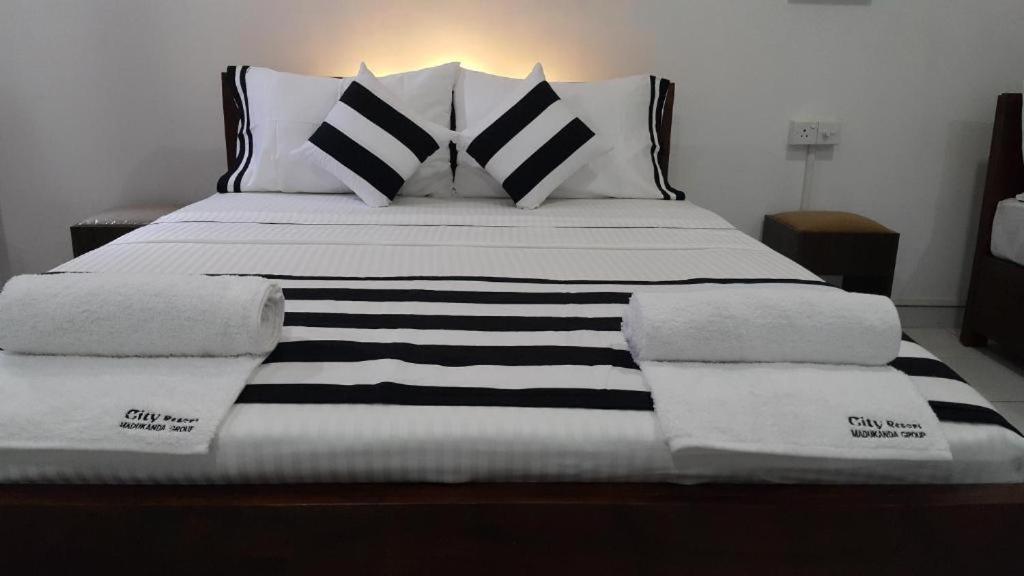 Postel nebo postele na pokoji v ubytování Aura City Hostel