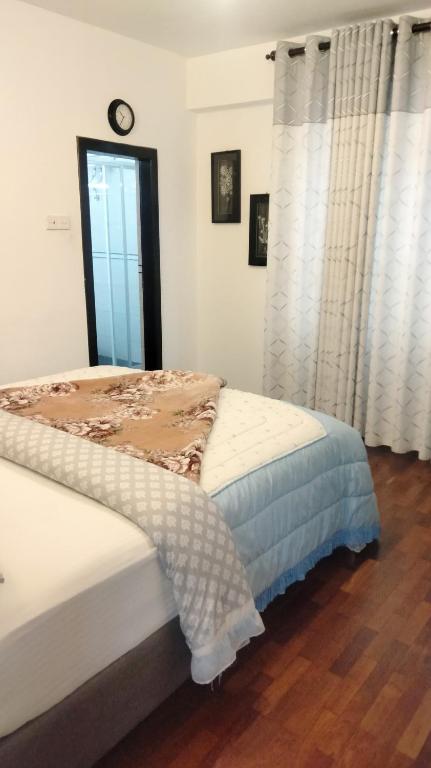 Postel nebo postele na pokoji v ubytování Nuwara eliya Luxury Apartment