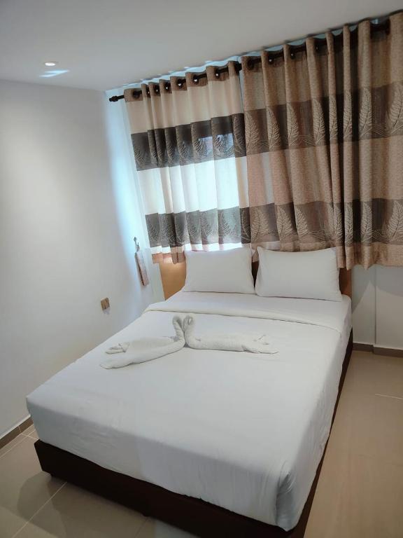 Postel nebo postele na pokoji v ubytování One Dream Hotel