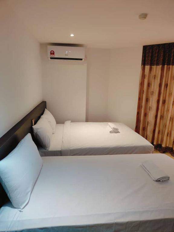 Postel nebo postele na pokoji v ubytování One Dream Hotel
