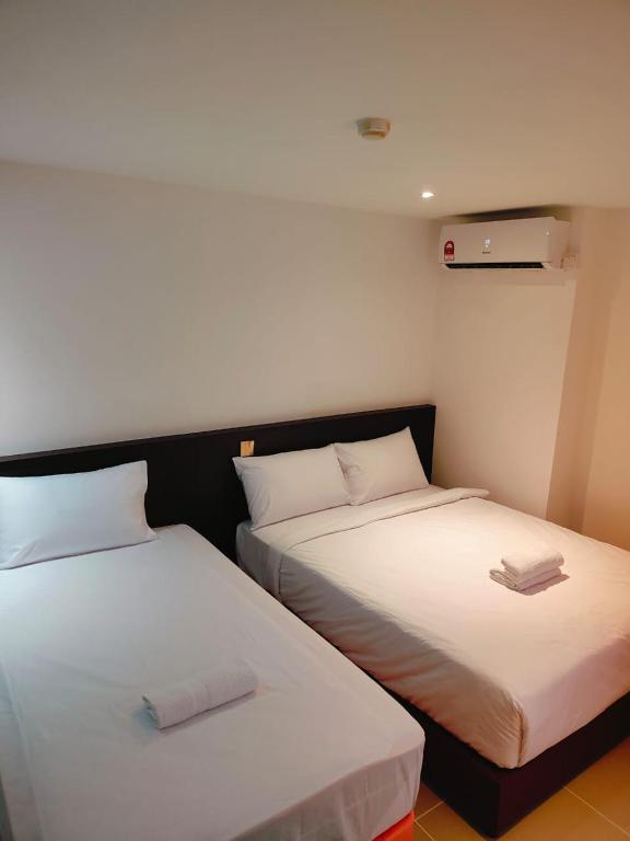 Postel nebo postele na pokoji v ubytování One Dream Hotel