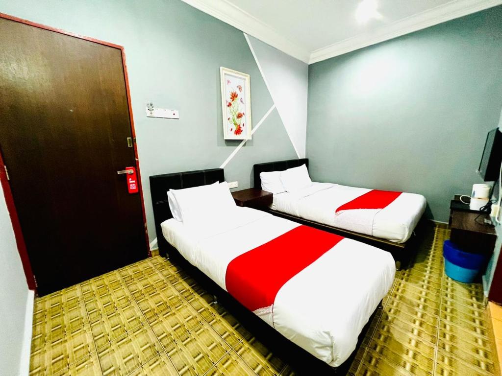 Postel nebo postele na pokoji v ubytování DAILY INN HOTEL