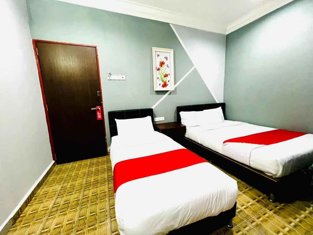 Postel nebo postele na pokoji v ubytování DAILY INN HOTEL