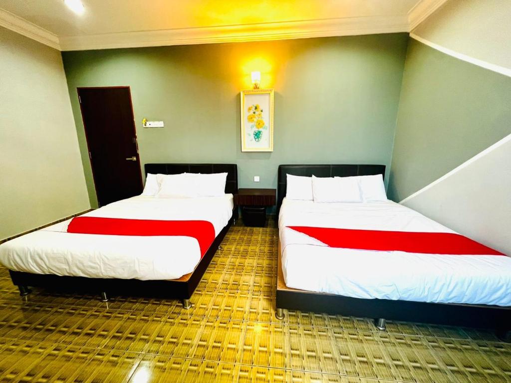 Postel nebo postele na pokoji v ubytování DAILY INN HOTEL