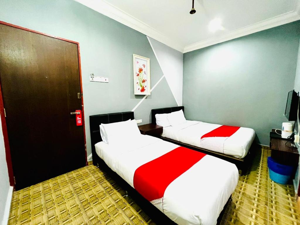 Postel nebo postele na pokoji v ubytování DAILY INN HOTEL