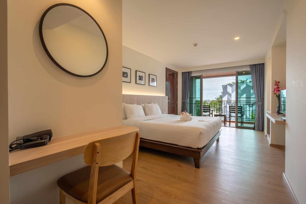 Postel nebo postele na pokoji v ubytování Orchidacea Resort - Kata Beach