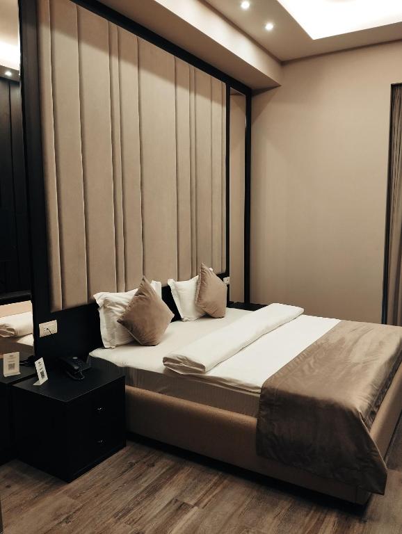 Postel nebo postele na pokoji v ubytování SOHO Hotel City Centre