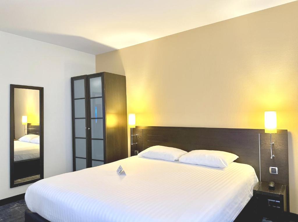 Postel nebo postele na pokoji v ubytování Ibis Styles Metz Centre Gare