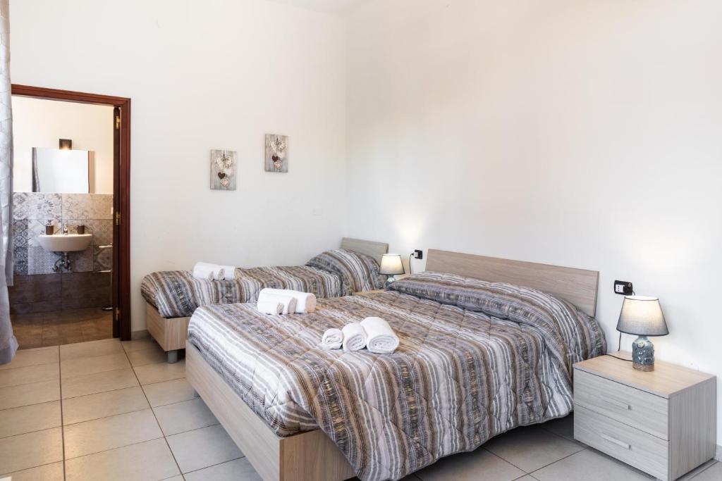 Posteľ alebo postele v izbe v ubytovaní Le Torrette Rooms and Apartments