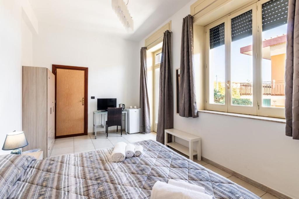 Posteľ alebo postele v izbe v ubytovaní Le Torrette Rooms and Apartments