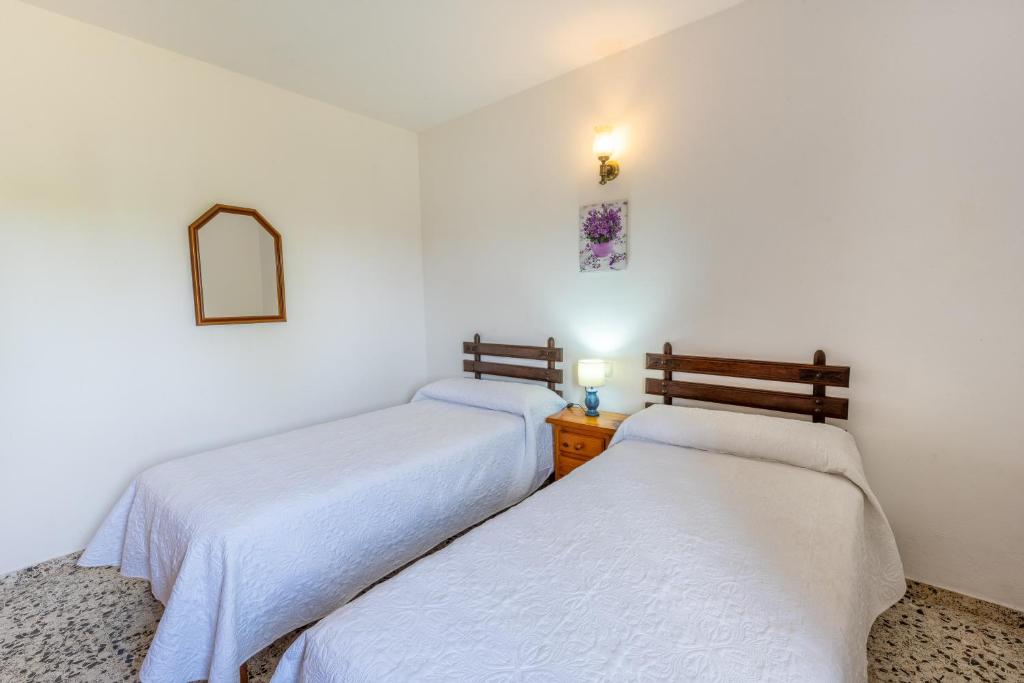 Postel nebo postele na pokoji v ubytování Villa Can Portmany