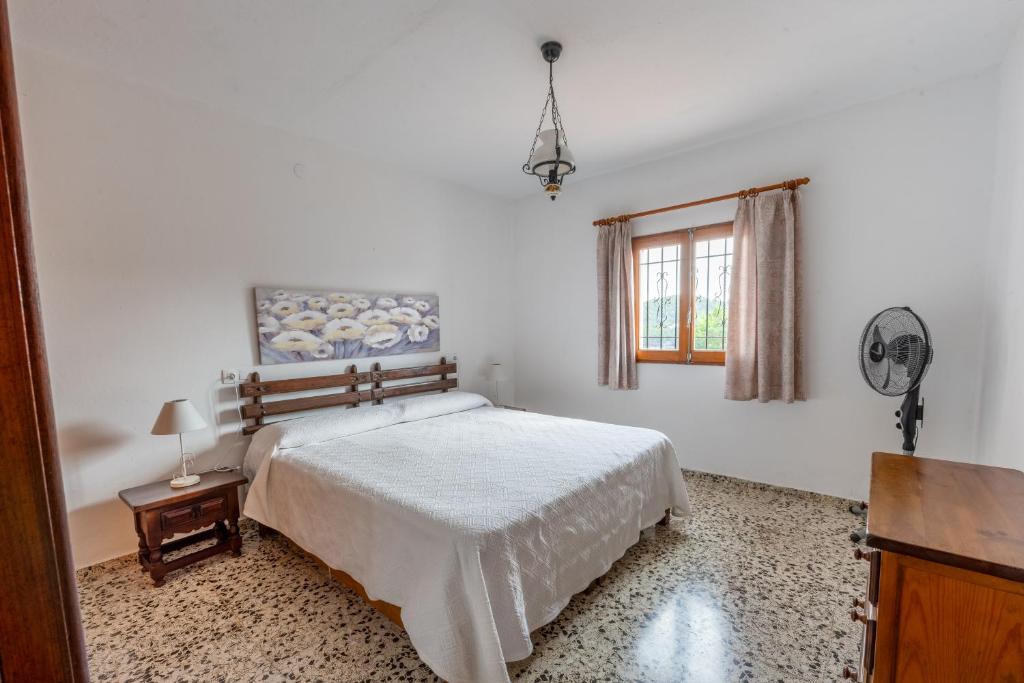 Postel nebo postele na pokoji v ubytování Villa Can Portmany