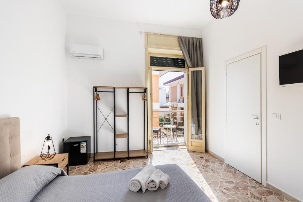 Posteľ alebo postele v izbe v ubytovaní Le Torrette Rooms and Apartments