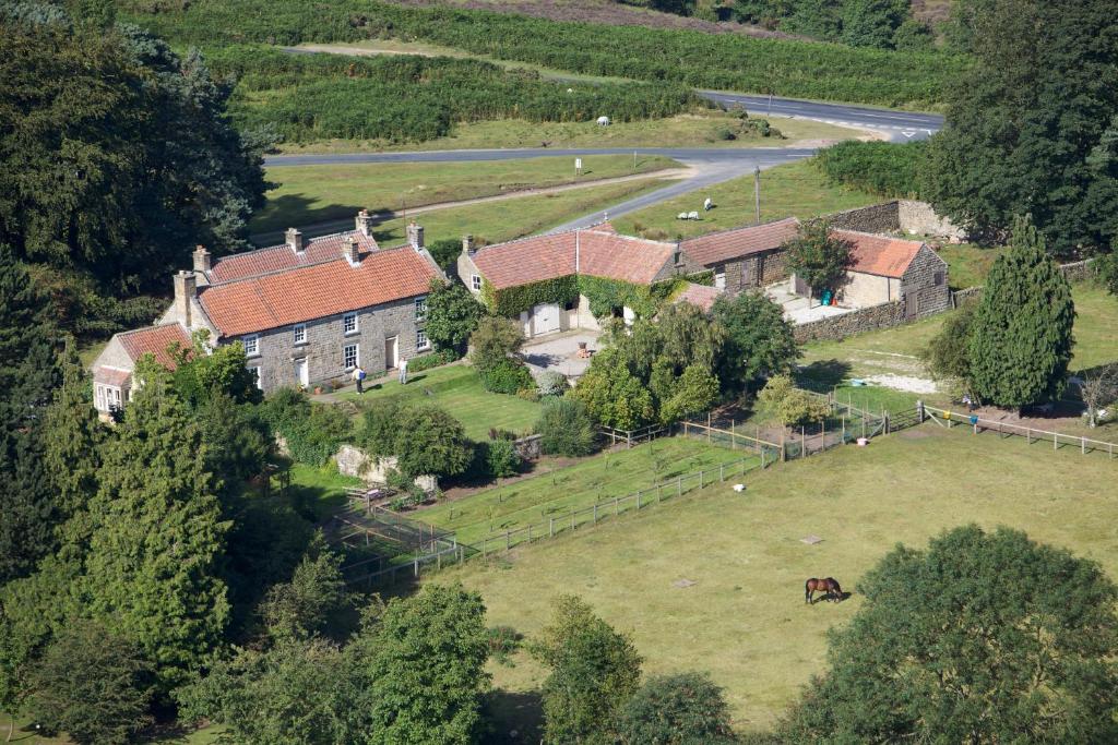 an aerial view of a large house on a hill at Barmoors in Lastingham