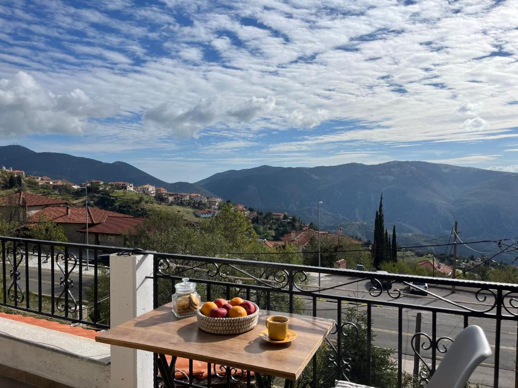 a bowl of fruit on a table on a balcony at Chalet Arachova - Breathtaking View in Arachova