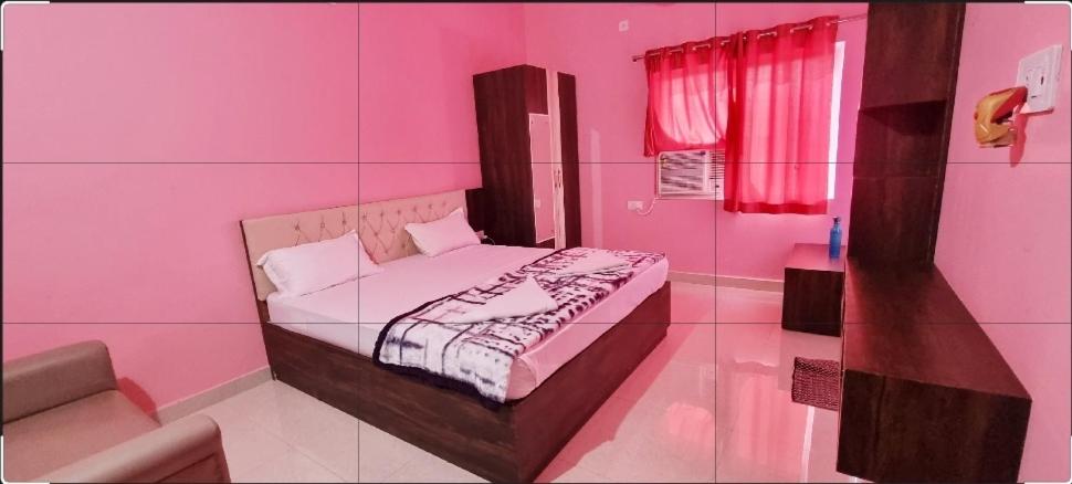 Postelja oz. postelje v sobi nastanitve MAHARAJA RESORT & GUEST HOUSE