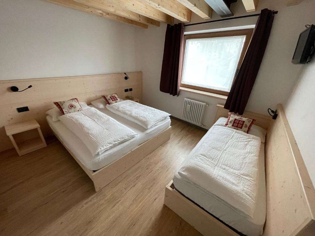 Postel nebo postele na pokoji v ubytování Tilde