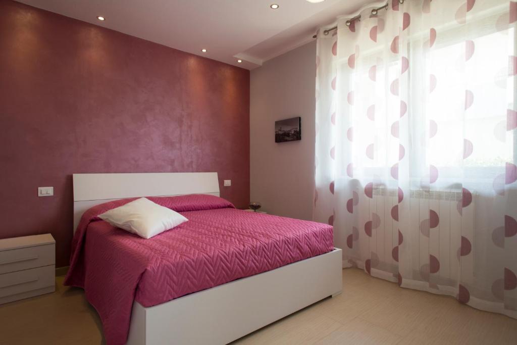 Łóżko lub łóżka w pokoju w obiekcie B&B Olganna
