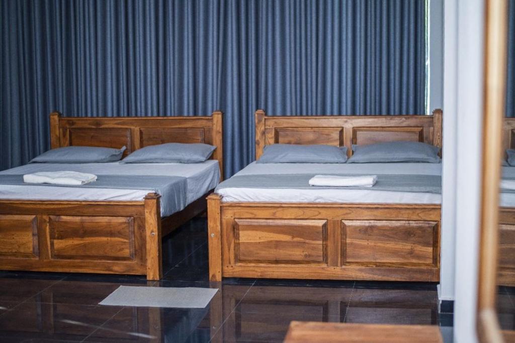 Postel nebo postele na pokoji v ubytování Grand Okka Hotel