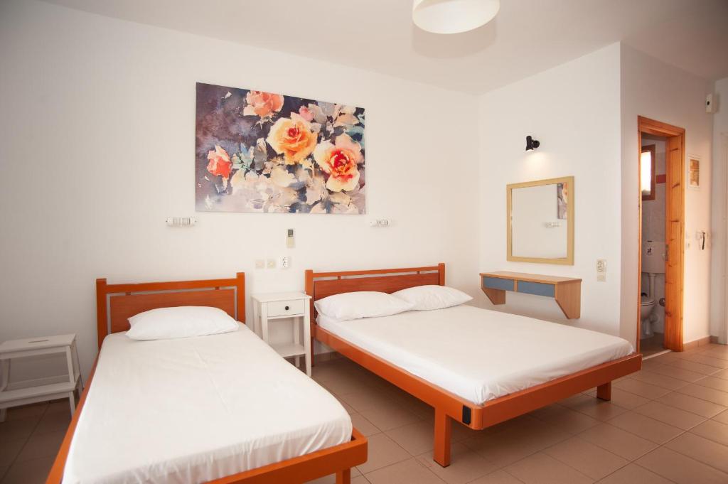Postel nebo postele na pokoji v ubytování Rosa's Beach Studios