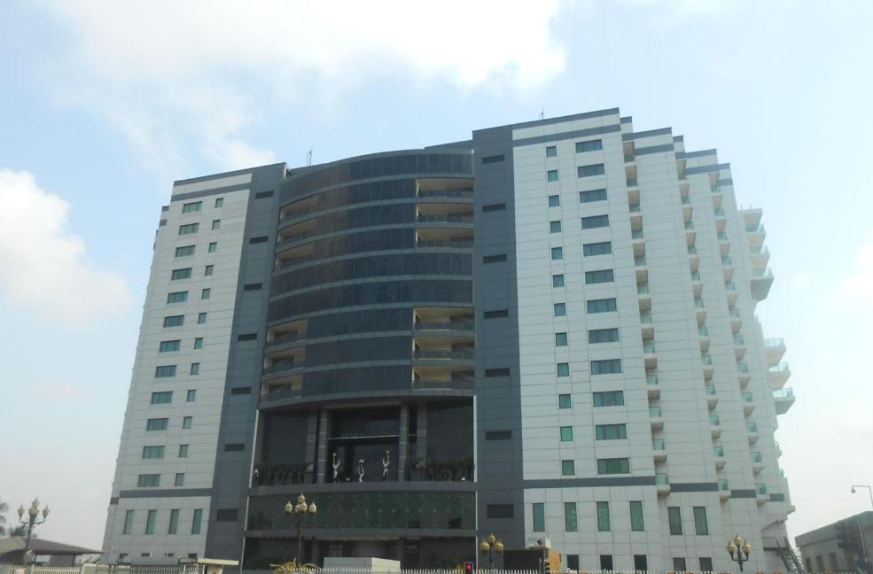 a tall building with a lot of windows at Black Diamond Hotel in Lagos