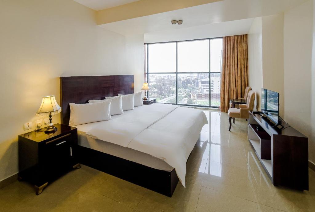 Ένα ή περισσότερα κρεβάτια σε δωμάτιο στο Black Diamond Hotel