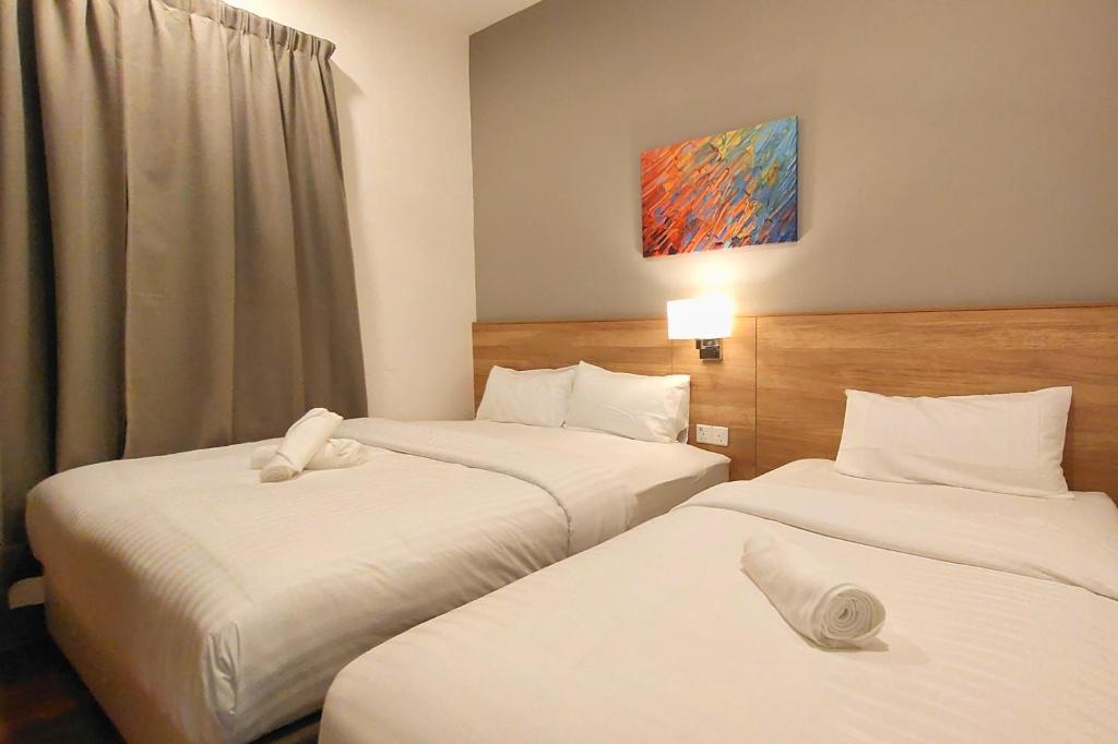 Postel nebo postele na pokoji v ubytování Sunway Onsen Suites - Theme Park Tambun Ipoh by Ryokan Management