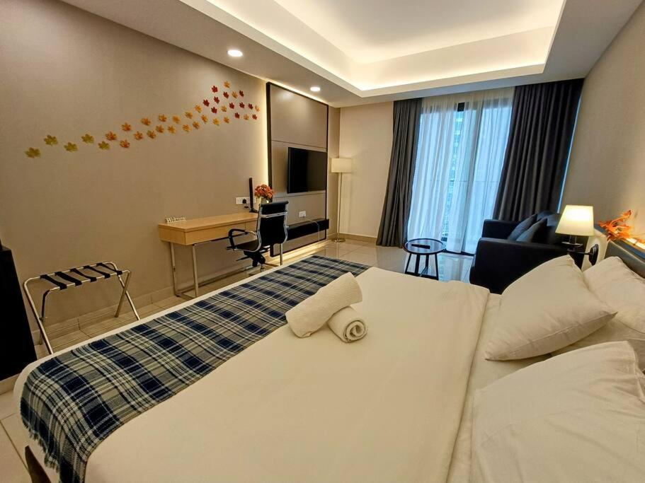 a hotel room with a large bed and a desk at Genting Peak 3PaxStudio412 @Ion Delemen in Genting Highlands